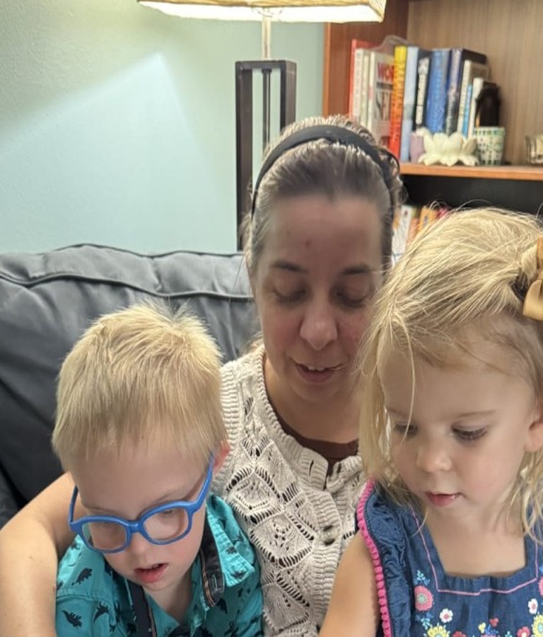 Close-up of shared storytime with Suzanne and the children
